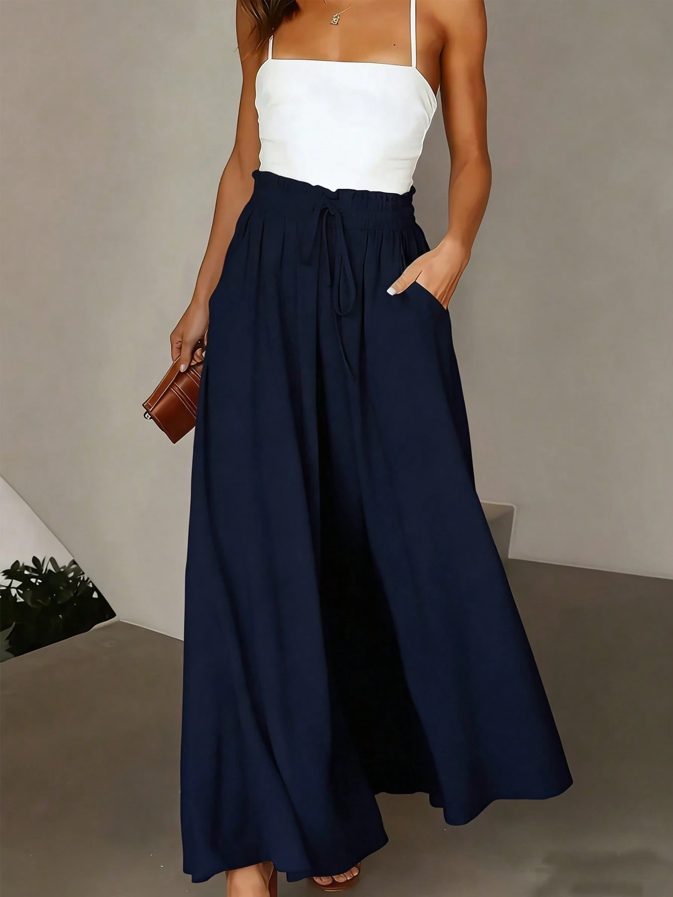 Pantalones de pierna ancha con bolsillo, cintura con lazo y volantes